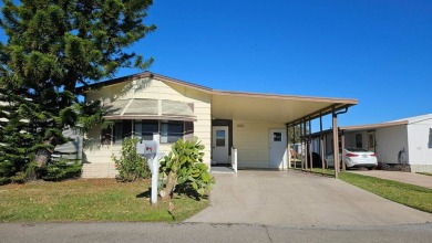 Cute 2 bedroom 2 bath home with newer flooring and is partially on Golden Lakes Golf Course in Florida - for sale on GolfHomes.com, golf home, golf lot