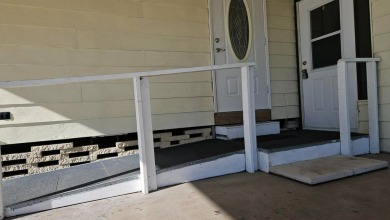 Cute 2 bedroom 2 bath home with newer flooring and is partially on Golden Lakes Golf Course in Florida - for sale on GolfHomes.com, golf home, golf lot