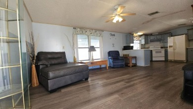 Cute 2 bedroom 2 bath home with newer flooring and is partially on Golden Lakes Golf Course in Florida - for sale on GolfHomes.com, golf home, golf lot