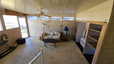 Cute 2 bedroom 2 bath home with newer flooring and is partially on Golden Lakes Golf Course in Florida - for sale on GolfHomes.com, golf home, golf lot