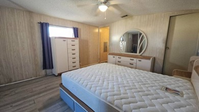 Cute 2 bedroom 2 bath home with newer flooring and is partially on Golden Lakes Golf Course in Florida - for sale on GolfHomes.com, golf home, golf lot