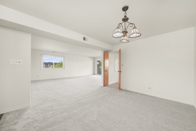 Perched on the top floor at the quiet corner of the building on Arlington Lakes Golf Club in Illinois - for sale on GolfHomes.com, golf home, golf lot