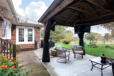 Beautiful single story ranch overlooking Pine Island Country on Pine Island Country Club in North Carolina - for sale on GolfHomes.com, golf home, golf lot