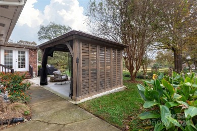 Beautiful single story ranch overlooking Pine Island Country on Pine Island Country Club in North Carolina - for sale on GolfHomes.com, golf home, golf lot