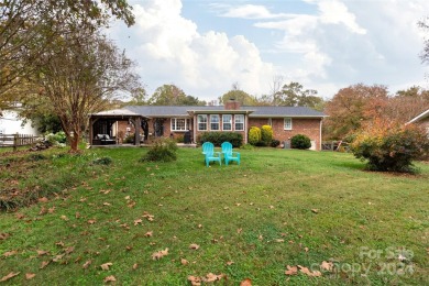 Beautiful single story ranch overlooking Pine Island Country on Pine Island Country Club in North Carolina - for sale on GolfHomes.com, golf home, golf lot