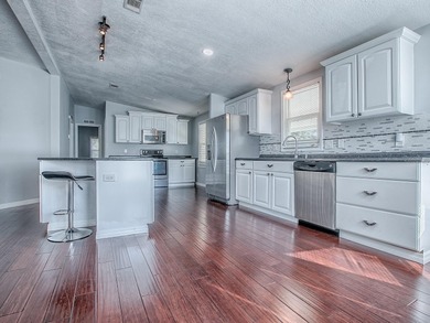 Completely remodeled manufactured home located in the desirable on El Diablo Executive Golf Course in Florida - for sale on GolfHomes.com, golf home, golf lot