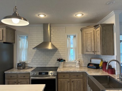 Entryway of the home has decorative frosted glass storm door on The Links of Lake Bernadette in Florida - for sale on GolfHomes.com, golf home, golf lot