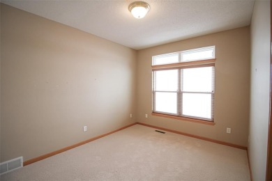 Open living room/dining room. Expensive carpet throughout. The on Hunters Ridge Golf Course in Iowa - for sale on GolfHomes.com, golf home, golf lot