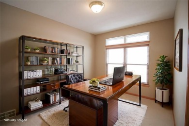 Open living room/dining room. Expensive carpet throughout. The on Hunters Ridge Golf Course in Iowa - for sale on GolfHomes.com, golf home, golf lot