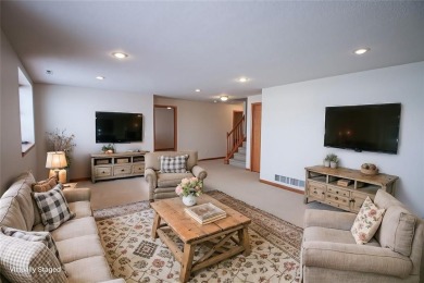 Open living room/dining room. Expensive carpet throughout. The on Hunters Ridge Golf Course in Iowa - for sale on GolfHomes.com, golf home, golf lot