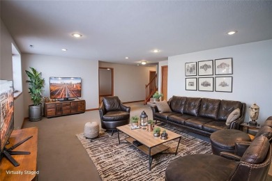 Open living room/dining room. Expensive carpet throughout. The on Hunters Ridge Golf Course in Iowa - for sale on GolfHomes.com, golf home, golf lot