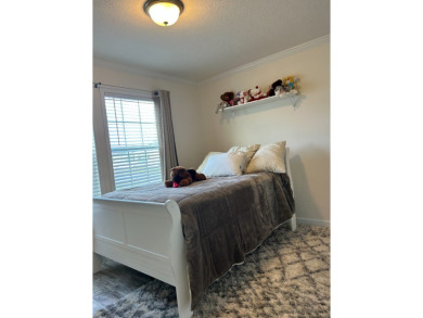 Entryway of the home has decorative frosted glass storm door on The Links of Lake Bernadette in Florida - for sale on GolfHomes.com, golf home, golf lot