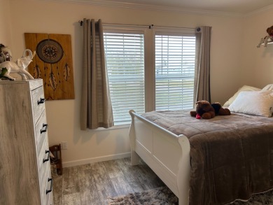 Entryway of the home has decorative frosted glass storm door on The Links of Lake Bernadette in Florida - for sale on GolfHomes.com, golf home, golf lot