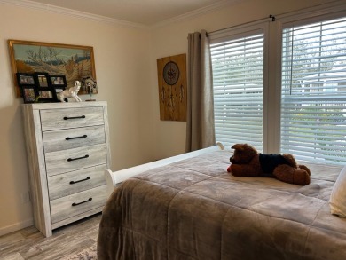 Entryway of the home has decorative frosted glass storm door on The Links of Lake Bernadette in Florida - for sale on GolfHomes.com, golf home, golf lot