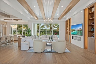 Enjoy sweeping southern exposure and serene golf course views on The Moorings Country Club in Florida - for sale on GolfHomes.com, golf home, golf lot