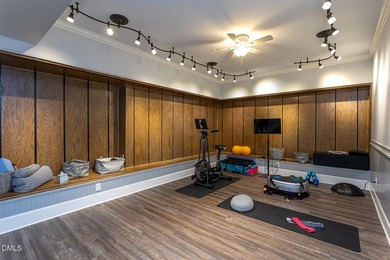 Designed for those who appreciate space with intention, this on Hasentree Club in North Carolina - for sale on GolfHomes.com, golf home, golf lot