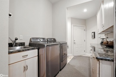 Nestled within an exclusive gated golf course community, this on Spirit Hollow Golf Course in Iowa - for sale on GolfHomes.com, golf home, golf lot