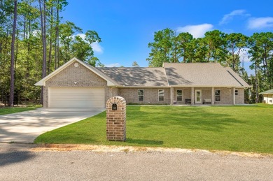 Serenity meets sophistication in this stunning waterfront on Rayburn Country Club in Texas - for sale on GolfHomes.com, golf home, golf lot