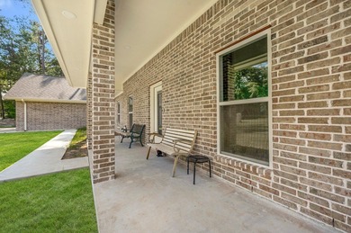 Serenity meets sophistication in this stunning waterfront on Rayburn Country Club in Texas - for sale on GolfHomes.com, golf home, golf lot