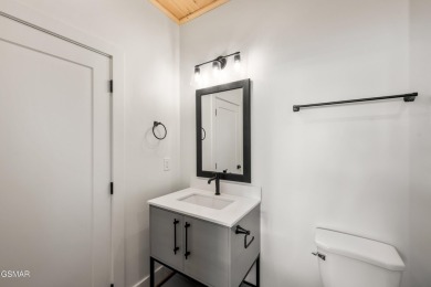 This newly constructed, fully furnished 4-bedroom, 4.5-bathroom on Sevierville Golf Club in Tennessee - for sale on GolfHomes.com, golf home, golf lot
