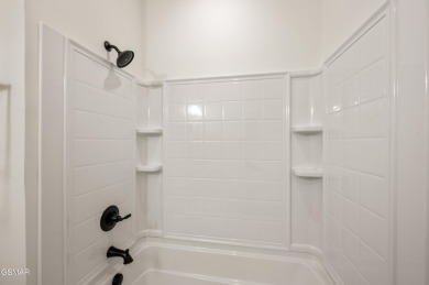 This newly constructed, fully furnished 4-bedroom, 4.5-bathroom on Sevierville Golf Club in Tennessee - for sale on GolfHomes.com, golf home, golf lot