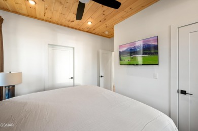 This newly constructed, fully furnished 4-bedroom, 4.5-bathroom on Sevierville Golf Club in Tennessee - for sale on GolfHomes.com, golf home, golf lot