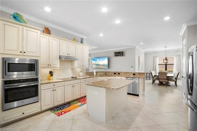 Set against tranquil lake views in highly sought-after Bonita on Bonita National Golf Course in Florida - for sale on GolfHomes.com, golf home, golf lot