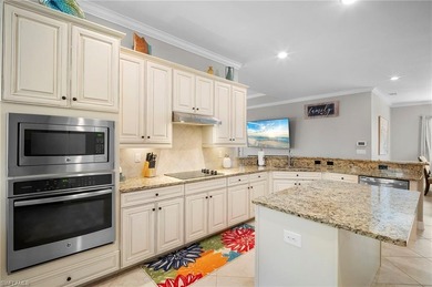 Set against tranquil lake views in highly sought-after Bonita on Bonita National Golf Course in Florida - for sale on GolfHomes.com, golf home, golf lot