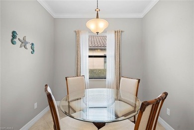 Set against tranquil lake views in highly sought-after Bonita on Bonita National Golf Course in Florida - for sale on GolfHomes.com, golf home, golf lot