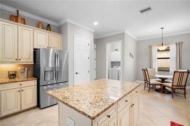 Set against tranquil lake views in highly sought-after Bonita on Bonita National Golf Course in Florida - for sale on GolfHomes.com, golf home, golf lot