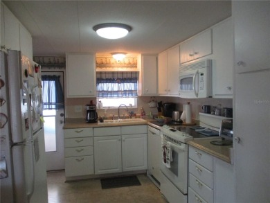 YOU'RE GONNA LOVE THIS 2 BEDROOM 2 BATH PARTIALLY FURNISHED on Heather Hills Golf Course in Florida - for sale on GolfHomes.com, golf home, golf lot