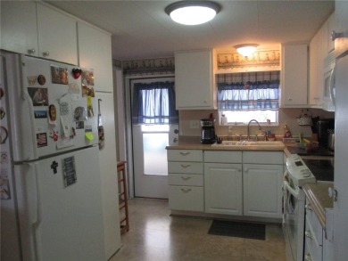 YOU'RE GONNA LOVE THIS 2 BEDROOM 2 BATH PARTIALLY FURNISHED on Heather Hills Golf Course in Florida - for sale on GolfHomes.com, golf home, golf lot