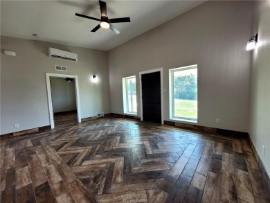Extremely Low AC bills - $48 in June, $59 in July, set at 72 on Hilltop Lakes Resort Golf Club in Texas - for sale on GolfHomes.com, golf home, golf lot