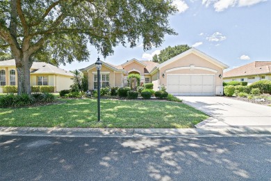 RARELY AVAILABLE POOL (SALTWATER W/HOT TUB) HOME IN WONDERFUL on Eagle Ridge At Spruce Creek Country Club in Florida - for sale on GolfHomes.com, golf home, golf lot