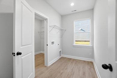 ONE OF TWO LAST REMAINING NEW HOMES...Eastwood Homes' stately on Woodside Plantation Country Club in South Carolina - for sale on GolfHomes.com, golf home, golf lot