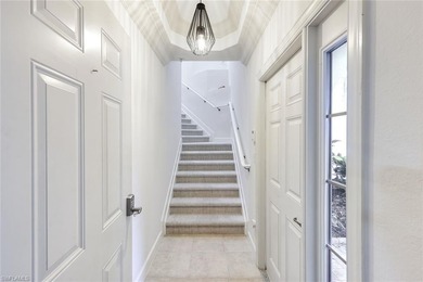 Luxury turnkey coach home overlooking the golf course in the on The Golf Lodge At the Quarry in Florida - for sale on GolfHomes.com, golf home, golf lot