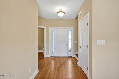 This thoughtfully designed home offers tranquil views of the on Members Club At St. James Plantation in North Carolina - for sale on GolfHomes.com, golf home, golf lot