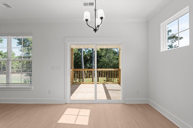 Discover Southern elegance in this exquisite Wescott Elevation A on Woodside Plantation Country Club in South Carolina - for sale on GolfHomes.com, golf home, golf lot