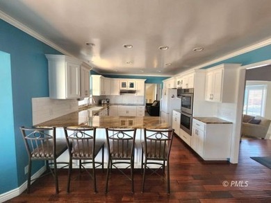 Panoramic views and an unbeatable location highlight this 6 bed on Lake Powell National Golf Course in Arizona - for sale on GolfHomes.com, golf home, golf lot