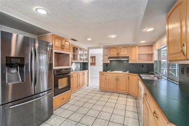 Under contract-accepting backup offers. One or more photo(s) has on Beacon Woods Golf Club in Florida - for sale on GolfHomes.com, golf home, golf lot