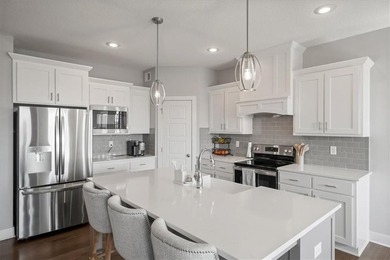 Stunning reverse 1.5-story home filled with natural light from on Shawnee Golf and Country Club in Kansas - for sale on GolfHomes.com, golf home, golf lot