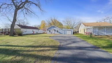 This cozy, updated cottage is the perfect retreat, offering on Ingersoll Golf Course and Learning Links in Illinois - for sale on GolfHomes.com, golf home, golf lot