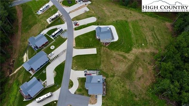 Experience the beauty of the Blue Ridge Mountains at The Village on Olde Beau Golf Course in North Carolina - for sale on GolfHomes.com, golf home, golf lot