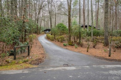 Located in Golf Club Estates, this modern residence, masterfully on The Country Club of Sapphire Valley in North Carolina - for sale on GolfHomes.com, golf home, golf lot