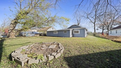 This cozy, updated cottage is the perfect retreat, offering on Ingersoll Golf Course and Learning Links in Illinois - for sale on GolfHomes.com, golf home, golf lot