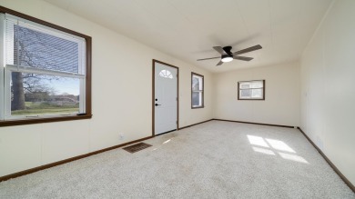 This cozy, updated cottage is the perfect retreat, offering on Ingersoll Golf Course and Learning Links in Illinois - for sale on GolfHomes.com, golf home, golf lot