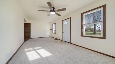 This cozy, updated cottage is the perfect retreat, offering on Ingersoll Golf Course and Learning Links in Illinois - for sale on GolfHomes.com, golf home, golf lot