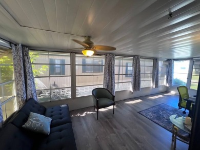 Discover easy Florida living in this 2-bedroom, 2-bath home on Lake Henry Golf Club in Florida - for sale on GolfHomes.com, golf home, golf lot