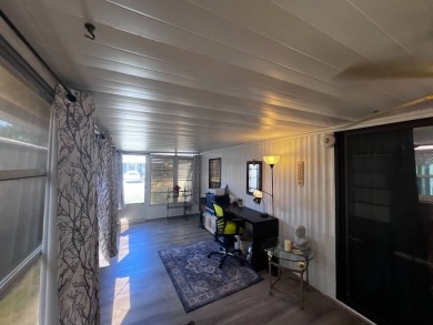 Discover easy Florida living in this 2-bedroom, 2-bath home on Lake Henry Golf Club in Florida - for sale on GolfHomes.com, golf home, golf lot