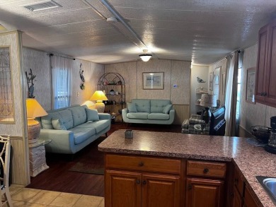 Discover easy Florida living in this 2-bedroom, 2-bath home on Lake Henry Golf Club in Florida - for sale on GolfHomes.com, golf home, golf lot
